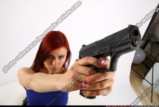 nina-kneeling-aiming-pistol