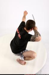 Man Adult Athletic White Fighting with sword Kneeling poses Sportswear