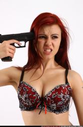 nina-sitting-pistol-pose3