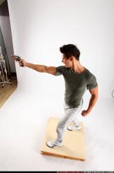lukas-standing-shooting-revolver
