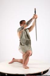Man Adult Athletic White Fighting with sword Kneeling poses Army