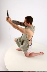 Man Adult Athletic White Fighting with sword Kneeling poses Army