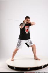 Man Adult Athletic White Fighting with sword Standing poses Sportswear