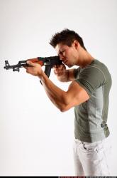 Man Adult Athletic White Fighting with submachine gun Standing poses Casual