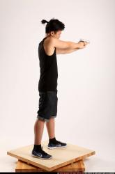 Jerald-mob-standing-aiming-pistol