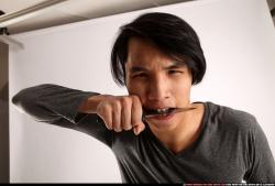 Man Young Athletic Fighting with knife Detailed photos Casual Asian