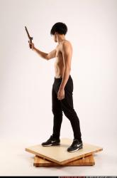 Man Young Athletic Fighting with rifle Standing poses Pants Asian