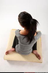 Woman Adult Athletic White Neutral Sitting poses Casual