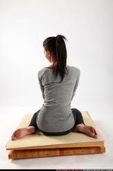 Woman Adult Athletic White Neutral Sitting poses Casual
