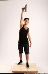 Jerald-mob-standing-raising-uzi