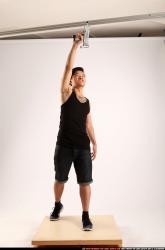 Jerald-mob-standing-raising-uzi