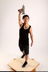 Jerald-mob-standing-raising-uzi