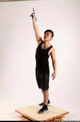 Jerald-mob-standing-raising-uzi