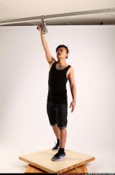 Jerald-mob-standing-raising-uzi