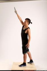 Jerald-mob-standing-raising-uzi