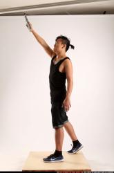 Jerald-mob-standing-raising-uzi