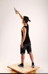 Jerald-mob-standing-raising-uzi