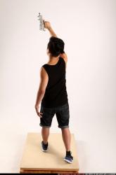 Jerald-mob-standing-raising-uzi