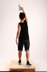 Jerald-mob-standing-raising-uzi