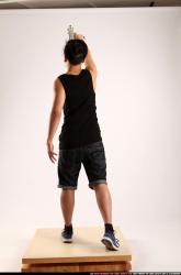 Jerald-mob-standing-raising-uzi