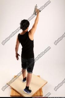 2014 08 JERALD MOB STANDING RAISING UZI 05 A