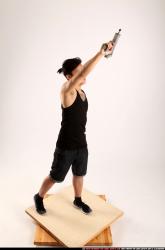 Jerald-mob-standing-raising-uzi