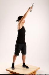 Jerald-mob-standing-raising-uzi