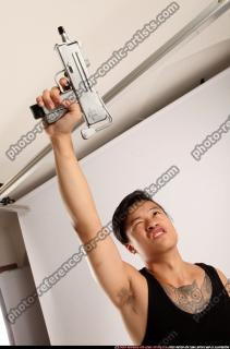 2014 08 JERALD MOB STANDING RAISING UZI 09