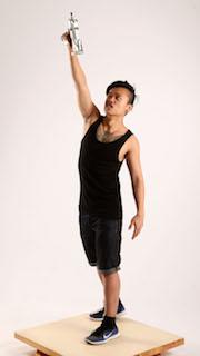 Jerald-mob-standing-raising-uzi