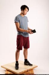Man Young Athletic Daily activities Standing poses Casual Asian