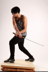 keiji-sword-swing-back