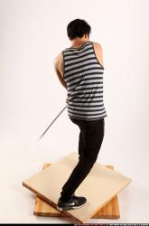 keiji-sword-swing-back