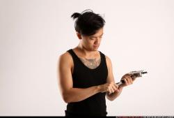 Man Young Athletic Reloading weapon Detailed photos Casual Asian