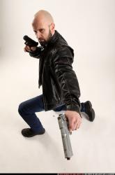 Man Adult Athletic White Fighting with gun Kneeling poses Casual
