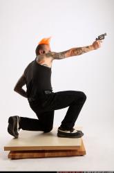edgar-kneeling-revolver-shooting