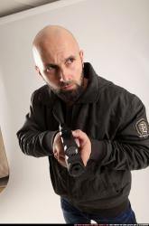 Man Adult Athletic White Fighting with gun Standing poses Jacket
