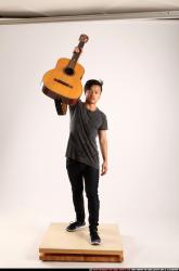 Jerald-lifting-guitar