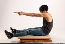 Man Young Athletic Fighting with gun Sitting poses Casual Latino
