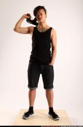 Man Young Athletic Fighting with submachine gun Standing poses Casual Asian
