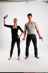 Man & Woman Adult Athletic White Fighting with gun Standing poses Casual