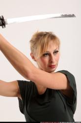 rachel-kneeling-sword-pose