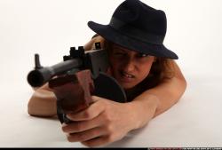 agnes-laying-shooting-tommygun