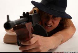 agnes-laying-shooting-tommygun