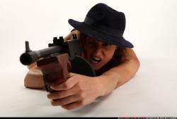 agnes-laying-shooting-tommygun