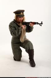 Woman Young Average Fighting with submachine gun Kneeling poses Army Asian