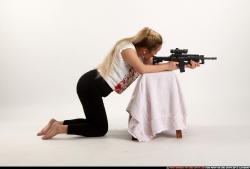 Woman Young Average Fighting with submachine gun Kneeling poses Casual Asian