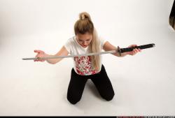 Woman Young Average Fighting with sword Kneeling poses Casual Asian