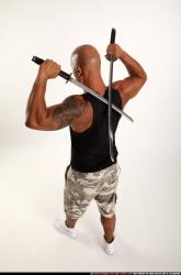 Man Adult Athletic Black Fighting with sword Standing poses Sportswear