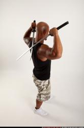 Man Adult Athletic Black Fighting with sword Standing poses Sportswear