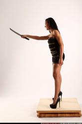 Woman Young Athletic Fighting with knife Standing poses Business Latino